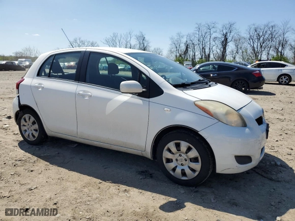 2009 Toyota Yaris with VIN JTDKT903695248767, listed as a Copart auction lot 52327265 with 211,184 mi miles and Salvage Title. Bid and sale history available at carsss.com. Image 4.