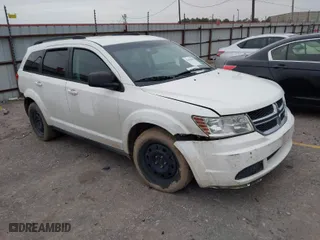 2014 Dodge Journey SE with VIN 3C4PDCAB5ET101484, listed as a IAAI auction lot 41603899 with 188,685 mi miles. Bid and sale history available at carsss.com. Image 1.