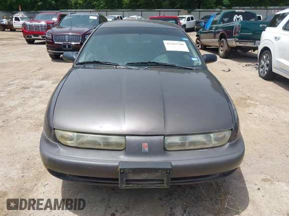 1999 Saturn SW z VIN 1G8ZK8270XZ189484, wystawiony jako IAAI lot #42265580 z przebiegiem 142 257 mil mil oraz . Historia ofert i sprzedaży dostępna na DreamBid. Obrazek 6.