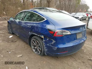 2020 Tesla Model 3 Standard Range Plus with VIN 5YJ3E1EA1LF658521, listed as a IAAI auction lot 41804722 with 83,248 mi miles and . Bid and sale history available at DreamBid. Image 3.