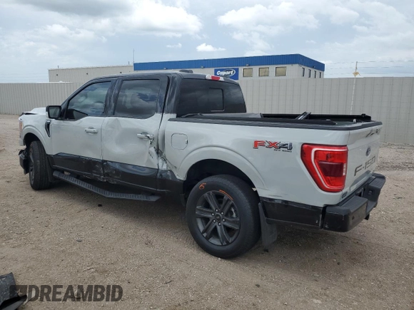 2023 Ford F-150 XL with VIN 1FTFW1E84PKE35275, listed as a Copart auction lot 61867535 with 22,142 mi miles and Salvage title. Bid and sale history available at DreamBid. Image 2.