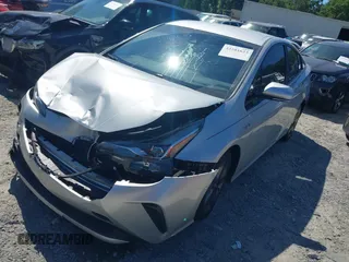 2020 Toyota Prius L Eco z VIN JTDKARFUXL3125434, wystawiony jako IAAI lot #42201623 z przebiegiem 58 609 mil mil oraz . Historia ofert i sprzedaży dostępna na DreamBid. Obrazek 2.
