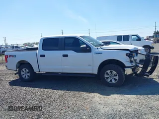 2015 Ford F-150 XLT z VIN 1FTEW1EPXFKE20880, wystawiony jako IAAI lot #42034493 z przebiegiem 152 588 mil mil oraz . Historia ofert i sprzedaży dostępna na DreamBid. Obrazek 13.