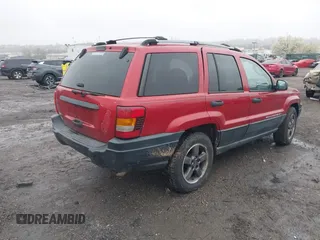 2004 Jeep Grand Cherokee Laredo with VIN 1J4GW48S94C151816, listed as a IAAI auction lot 41983332 with 151,227 mi miles. Bid and sale history available at carsss.com. Image 4.