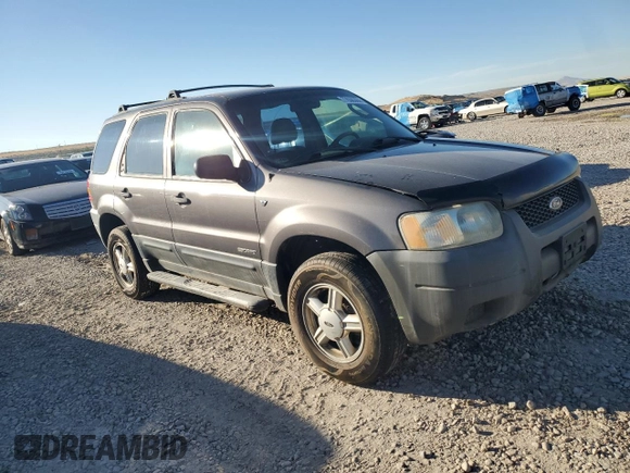 2002 Ford Escape XLS Choice with VIN 1FMYU021X2KC77142, listed as a Copart auction lot 77036384 with 213,292 mi miles and Clean title. Bid and sale history available at DreamBid. Image 4.