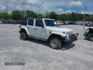 2018 Jeep Wrangler Unlimited Sahara with VIN 1C4HJXEG1JW233043, listed as a IAAI auction lot 42523058 with 73,753 mi miles and . Bid and sale history available at DreamBid. Image 1.