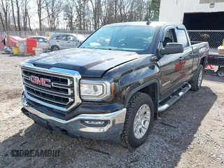 2018 GMC Sierra 1500 SLE z VIN 1GTV2MEC3JZ143967, wystawiony jako IAAI lot #41853850 z przebiegiem 80 205 mil mil oraz . Historia ofert i sprzedaży dostępna na DreamBid. Obrazek 6.
