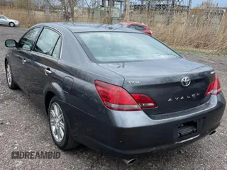 2010 Toyota Avalon XL with VIN 4T1BK3DB5AU353288, listed as a Copart auction lot 56857935 with 233,775 mi miles and Clean Title. Bid and sale history available at DreamBid. Image 3.