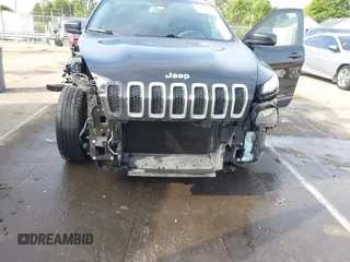 2014 Jeep Cherokee Sport with VIN 1C4PJLAB1EW221415, listed as a IAAI auction lot 42170364 with 182,813 mi miles and . Bid and sale history available at DreamBid. Image 6.