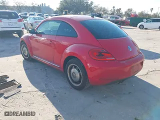 2012 Volkswagen Beetle 2.5L with VIN 3VWJX7AT5CM648739, listed as a IAAI auction lot 41547850 with 214,941 mi miles. Bid and sale history available at carsss.com. Image 3.
