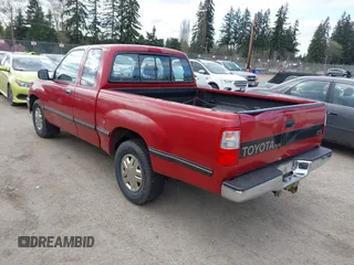 1995 Toyota T100 DX with VIN JT4VD12E6S0005957, listed as a IAAI auction lot 41943578 with 128,489 mi miles. Bid and sale history available at carsss.com. Image 3.