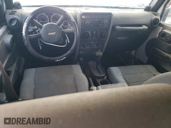 2007 Jeep Wrangler Unlimited Sahara с VIN 1J4GA591X7L158014, выставлен на аукционе Copart как лот 55201105 с пробегом 162 797 миль миль и Списание • Salvage title. История ставок и продаж доступна на DreamBid. Изображение 8.