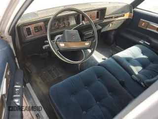 1987 Oldsmobile Cutlass z VIN 2G3GM51Y1H2347545, wystawiony jako Copart lot #76087594 z przebiegiem 98 257 mil mil oraz Szkody całkowita. Historia ofert i sprzedaży dostępna na DreamBid. Obrazek 8.