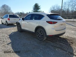 2018 Mazda CX-5 Grand Touring with VIN JM3KFADM0J0377026, listed as a IAAI auction lot 41649686 with 100,901 mi miles and . Bid and sale history available at DreamBid. Image 3.