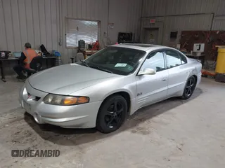 2000 Pontiac Bonneville SLE z VIN 1G2HY54K8Y4266136, wystawiony jako IAAI lot #37856460 z przebiegiem 190 979 mil mil oraz . Historia ofert i sprzedaży dostępna na DreamBid. Obrazek 2.