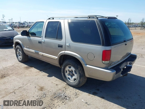 2003 Chevrolet Blazer LS z VIN 1GNDT13X63K146670, wystawiony jako IAAI lot #42200426 z przebiegiem 129 516 mil mil oraz . Historia ofert i sprzedaży dostępna na DreamBid. Obrazek 3.