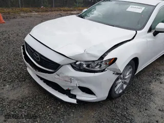 2016 Mazda Mazda6 i Sport with VIN JM1GJ1U52G1431967, listed as a IAAI auction lot 41602804 with 130,579 mi miles. Bid and sale history available at carsss.com. Image 6.