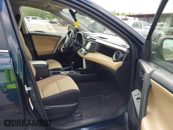 2018 Toyota RAV4 XLE with VIN JTMWFREV9JJ165655, listed as a IAAI auction lot 42138998 with 123,569 mi miles and . Bid and sale history available at carsss.com. Image 5.