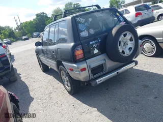 1998 Toyota RAV4 with VIN JT3GP10V7W7037711, listed as a IAAI auction lot 42081313 with 233,554 mi miles. Bid and sale history available at carsss.com. Image 3.