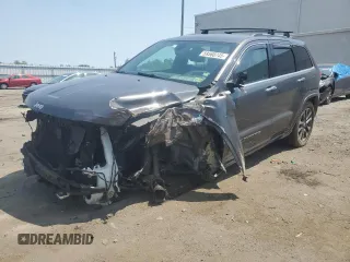 2017 Jeep Grand Cherokee Overland with VIN 1C4RJFCG3HC874658, listed as a Copart auction lot 59568745 with 143,232 mi miles and Salvage title. Bid and sale history available at DreamBid. Image 1.