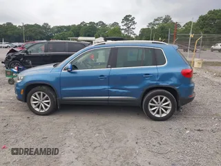2017 Volkswagen Tiguan Wolfsburg Edition z VIN WVGSV7AXXHW512884, wystawiony jako IAAI lot #42295807 z przebiegiem 79 298 mil mil oraz . Historia ofert i sprzedaży dostępna na DreamBid. Obrazek 14.