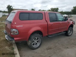 2001 Ford F-150 SuperCrew XLT with VIN 1FTRW08W01KE02928, listed as a Copart auction lot 73629704 with 313,859 mi miles and Salvage Title. Bid and sale history available at carsss.com. Image 3.
