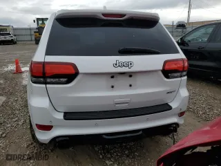 2015 Jeep Grand Cherokee SRT with VIN 1C4RJFDJ8FC919486, listed as a Copart auction lot 76821994 with 114,944 mi miles and Salvage Title. Bid and sale history available at carsss.com. Image 6.