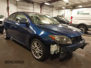 2009 Scion tC with VIN JTKDE167990297921, listed as a IAAI auction lot 41720687 with 159,960 mi miles. Bid and sale history available at carsss.com. Image 1.