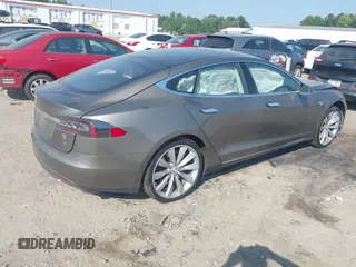 2016 Tesla Model S 70 with VIN 5YJSA1E1XGF126620, listed as a IAAI auction lot 40227035 with 71,400 mi miles and . Bid and sale history available at DreamBid. Image 4.
