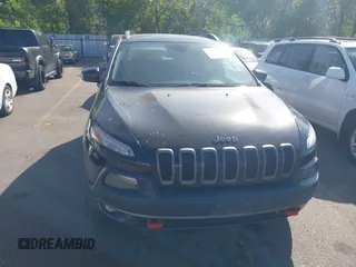 2015 Jeep Cherokee Trailhawk with VIN 1C4PJMBS4FW556822, listed as a IAAI auction lot 42412874 with 129,865 mi miles and . Bid and sale history available at DreamBid. Image 12.