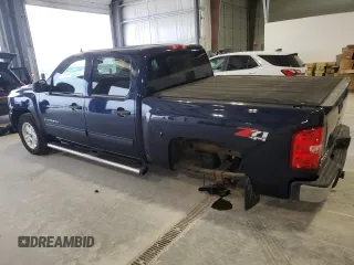 2011 Chevrolet Silverado 1500 LT with VIN 3GCPKSE33BG272919, listed as a Copart auction lot 51227155 with 140,936 mi miles and Salvage Title. Bid and sale history available at DreamBid. Image 2.