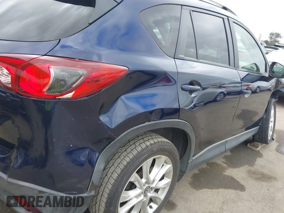 2014 Mazda CX-5 Grand Touring with VIN JM3KE2DY1E0307911, listed as a IAAI auction lot 42064898 with 133,934 mi miles. Bid and sale history available at carsss.com. Image 18.