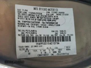 2005 Ford Taurus SE z VIN 1FAFP53215A212736, wystawiony jako Copart lot #58439495 z przebiegiem Nie podano mil oraz Szkoda całkowita • Salvage title. Historia ofert i sprzedaży dostępna na DreamBid. Obrazek 12.