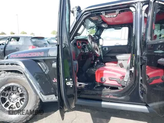 2022 Jeep Wrangler Unlimited Rubicon with VIN 1C4HJXFN0NW242903, listed as a IAAI auction lot 41448636 with 28,007 mi miles and . Bid and sale history available at DreamBid. Image 5.