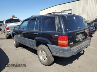 1998 Jeep Grand Cherokee Laredo with VIN 1J4GZ58Y4WC109610, listed as a Copart auction lot 58705124 with 247,990 mi miles and Salvage Title. Bid and sale history available at carsss.com. Image 2.