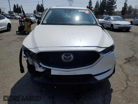 2018 Mazda CX-5 Grand Touring z VIN JM3KFADM3J1464073, wystawiony jako Copart lot #59571385 z przebiegiem Nie podano mil oraz Szkoda całkowita • Salvage title. Historia ofert i sprzedaży dostępna na DreamBid. Obrazek 5.