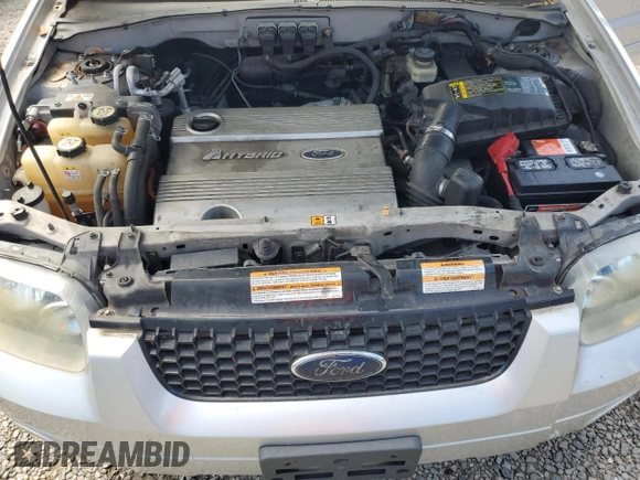 2006 Ford Escape Hybrid z VIN 1FMCU96H36KA35403, wystawiony jako Copart lot #65374705 z przebiegiem 127 689 mil mil oraz Czysty tytuł • Clean title. Historia ofert i sprzedaży dostępna na DreamBid. Obrazek 11.