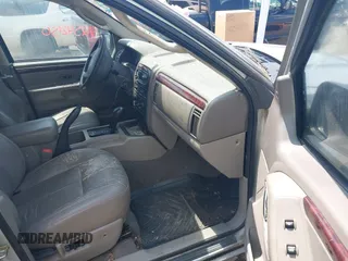 2004 Jeep Grand Cherokee Limited with VIN 1J4GW58N64C283657, listed as a IAAI auction lot 42542150 with 228,910 mi miles and . Bid and sale history available at DreamBid. Image 5.
