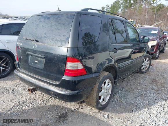 2000 Mercedes-Benz M-Class with VIN 4JGAB72E9YA208069, listed as a IAAI auction lot 41530528 with 155,967 mi miles. Bid and sale history available at carsss.com. Image 4.