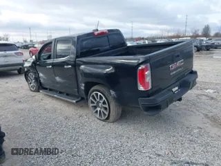 2021 GMC Canyon 4WD Denali with VIN 1GTG6EEN9M1221529, listed as a IAAI auction lot 41228498 with 67,727 mi miles. Bid and sale history available at carsss.com. Image 3.
