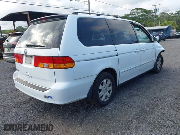 2004 Honda Odyssey EX-L with VIN 5FNRL18924B064040, listed as a IAAI auction lot 41350306 with 130,803 mi miles and . Bid and sale history available at DreamBid. Image 4.
