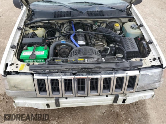 1995 Jeep Grand Cherokee Laredo z VIN 1J4GZ58S2SC578183, wystawiony jako Copart lot #61665955 z przebiegiem 341 135 mil mil oraz Szkoda całkowita • Salvage title. Historia ofert i sprzedaży dostępna na DreamBid. Obrazek 11.