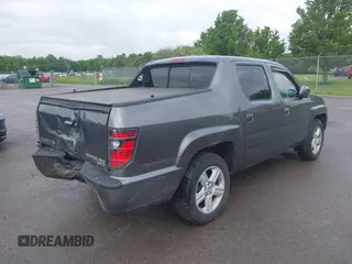 2014 Honda Ridgeline RTL with VIN 5FPYK1F5XEB011772, listed as a IAAI auction lot 42440390 with 145,219 mi miles and . Bid and sale history available at DreamBid. Image 4.
