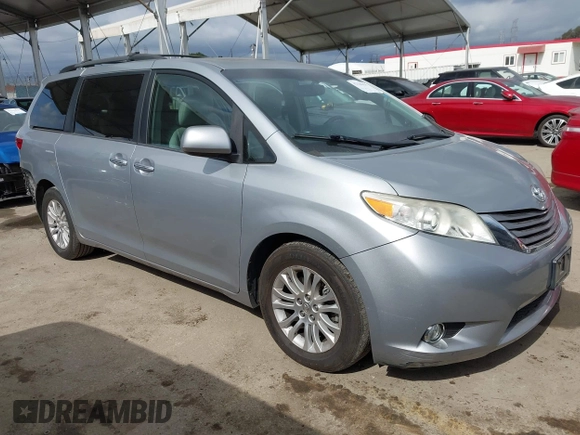 2015 Toyota Sienna XLE with VIN 5TDYK3DC1FS611521, listed as a IAAI auction lot 42136356 with 102,734 mi miles. Bid and sale history available at carsss.com. Image 1.