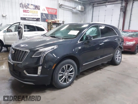 2023 Cadillac XT5 AWD Premium Luxury with VIN 1GYKNDRS2PZ122350, listed as a IAAI auction lot 42123718 with 17,971 mi miles and . Bid and sale history available at DreamBid. Image 2.