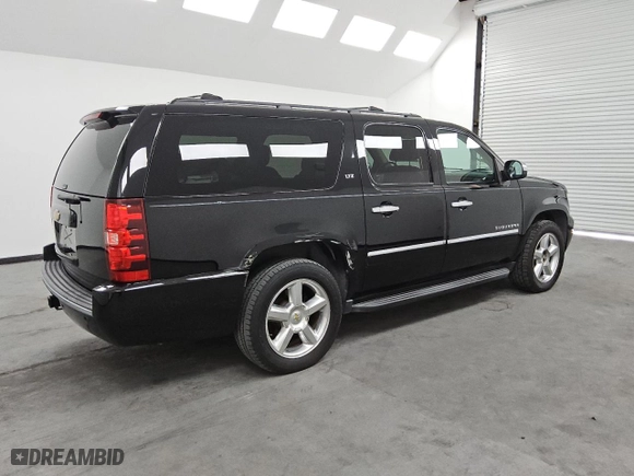 2013 Chevrolet Suburban LTZ with VIN 1GNSKKE79DR371333, listed as a Copart auction lot 74394354 with 165,171 mi miles and Clean Title. Bid and sale history available at carsss.com. Image 3.