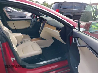 2020 Tesla Model S Long Range with VIN 5YJSA1E25LF396213, listed as a IAAI auction lot 42383231 with 73,125 mi miles and . Bid and sale history available at DreamBid. Image 5.