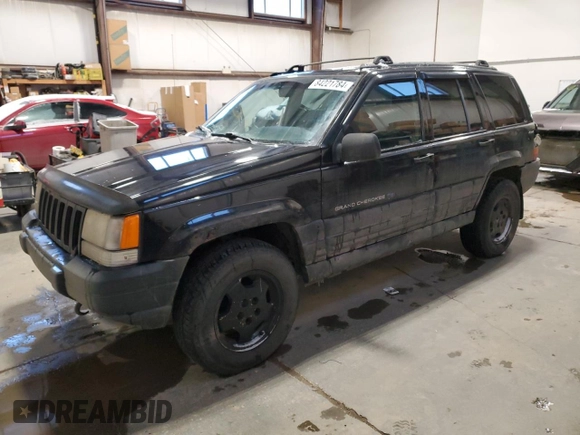 1998 Jeep Grand Cherokee Laredo with VIN 1J4GZ58Y9WC122076, listed as a Copart auction lot 84221784 with 387,353 mi miles and Salvage Title. Bid and sale history available at carsss.com. Image 1.