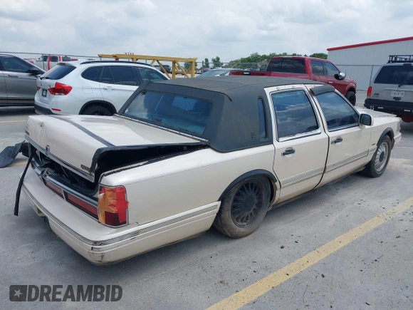 1997 Lincoln Town Car Cartier with VIN 1LNLM83W8VY627663, listed as a IAAI auction lot 42392454 with 209,440 mi miles and . Bid and sale history available at DreamBid. Image 4.