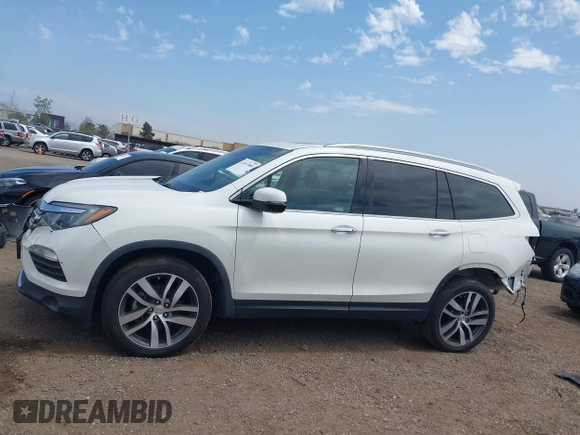 2017 Honda Pilot Touring with VIN 5FNYF5H95HB042632, listed as a IAAI auction lot 42011885 with 103,321 mi miles. Bid and sale history available at carsss.com. Image 15.